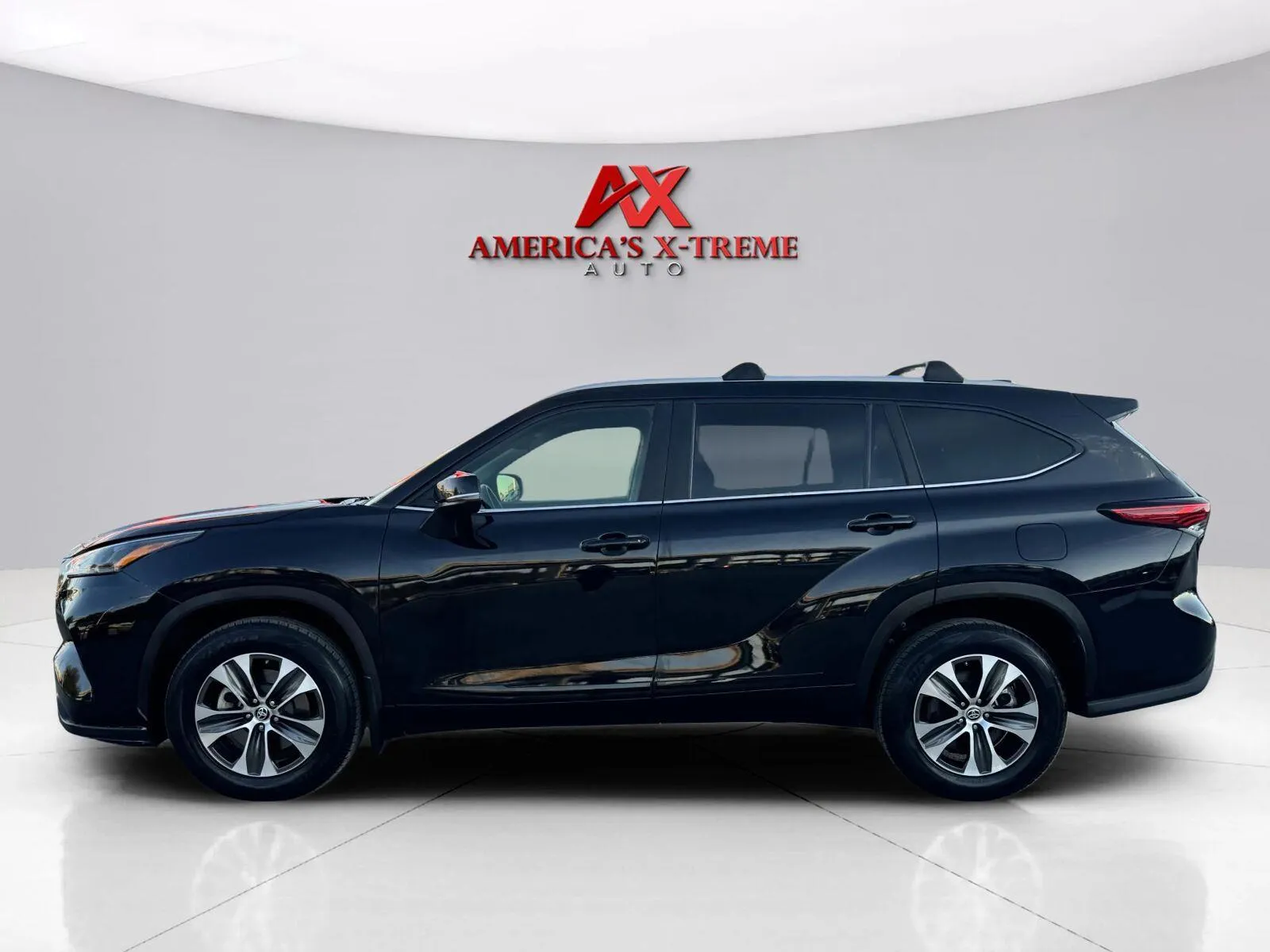 Photos of 2022 Toyota Highlander XLE for sale in Houston, TX at America's Xtreme Auto Sales & Auto Repair | Luxury Used Cars & Trucks Dealership
