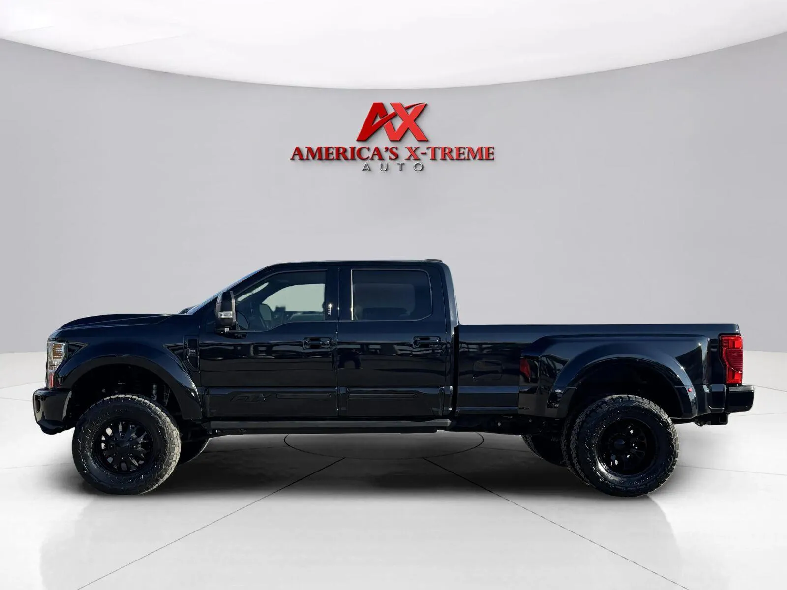 Photos of 2021 Ford Super Duty F-350 DRW Lariat for sale in Houston, TX at America's Xtreme Auto Sales & Auto Repair | Luxury Used Cars & Trucks Dealership
