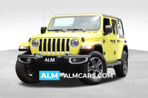 Yellow 2023 Jeep Wrangler Sahara for sale in Roswell, GA
