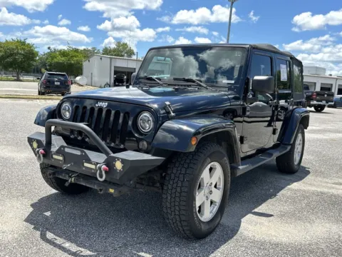 Black 2010 Jeep Wrangler Unlimited Sahara for sale in Pensacola, FL