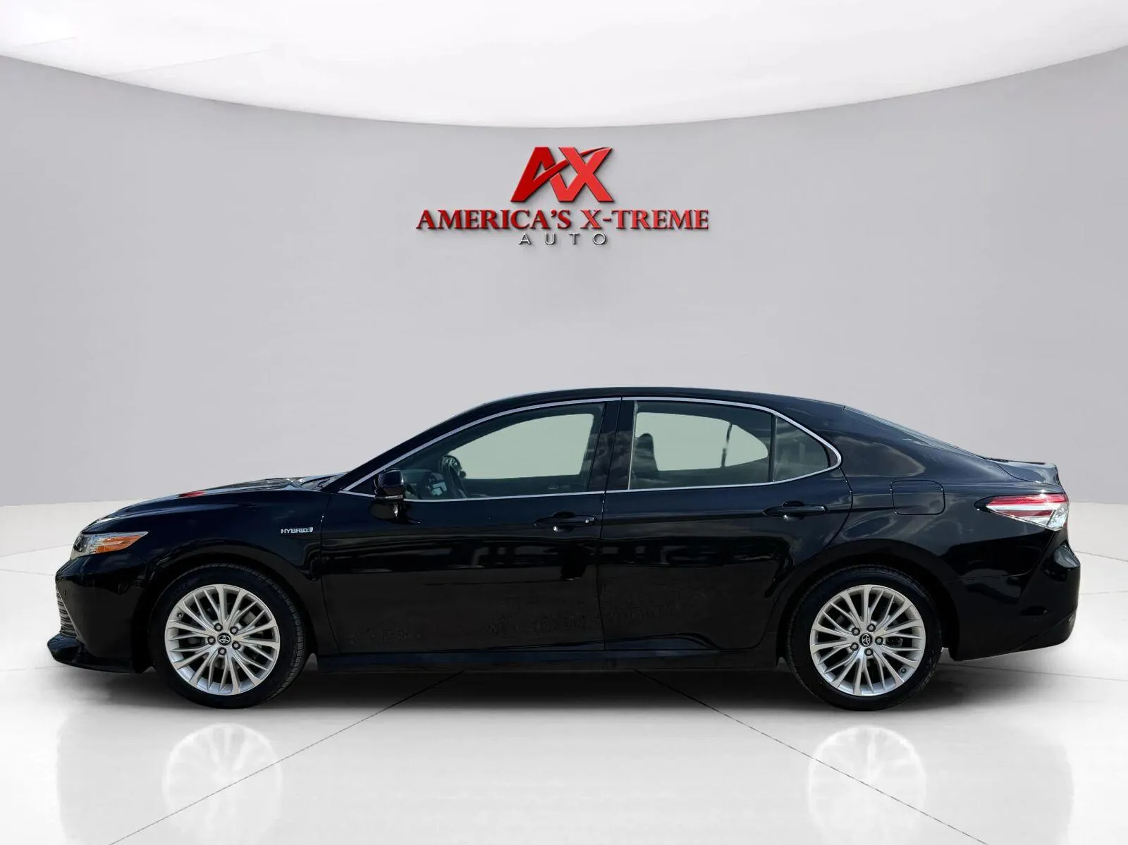 Photos of 2018 Toyota Camry Hybrid XLE for sale in Houston, TX at America's Xtreme Auto