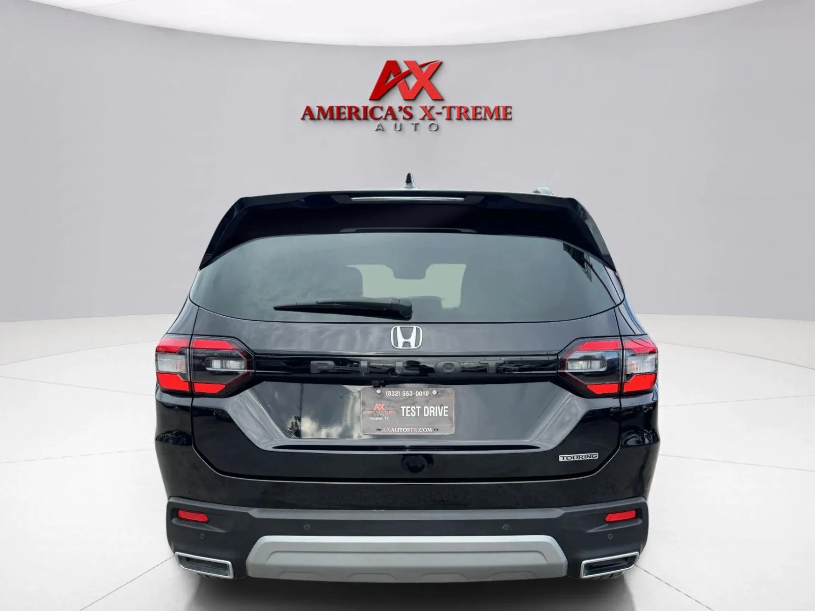 More photos of 2023 Honda Pilot Touring at America's Xtreme Auto, TX