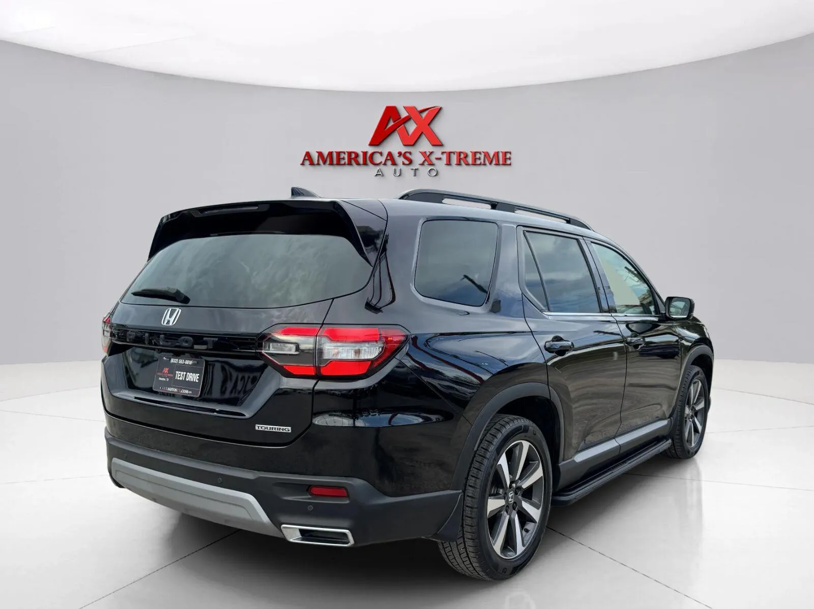 More photos of 2023 Honda Pilot Touring at America's Xtreme Auto, TX