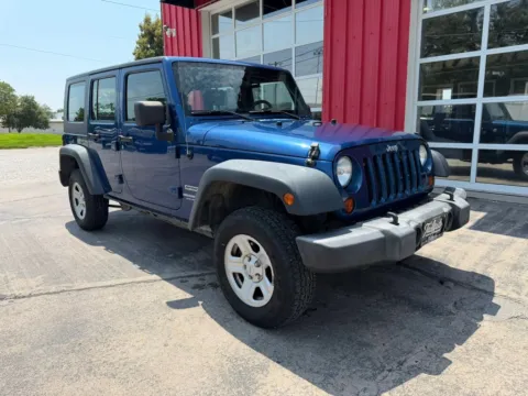 Photos of 2010 Jeep Wrangler Unlimited Sport SUV 4D for sale in Fremont, NE at Tailgate Motor Co. (Fremont South)