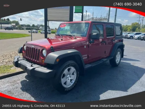 Red 2011 Jeep Wrangler Unlimited Sport SUV 4D for sale in Circleville, OH