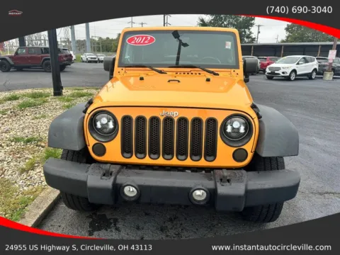 Photos of 2012 Jeep Wrangler Sport SUV 2D for sale in Circleville, OH at Instant Auto Sales Circleville