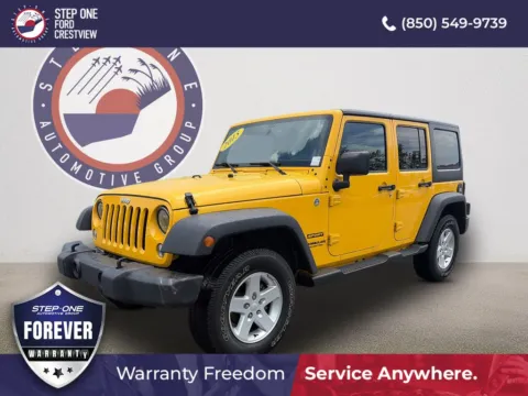 Yellow 2015 Jeep Wrangler Unlimited Sport for sale in Crestview, FL