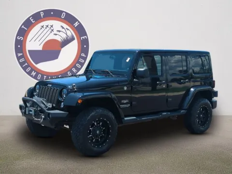 Photos of 2014 Jeep Wrangler Unlimited Sahara for sale in Fort Walton Beach, FL at Step One Kia Fort Walton Beach