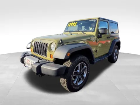 Another view of 2013 Jeep Wrangler Sahara for sale in Webster, NY at Auto Outlets of Webster