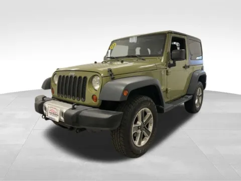 Another view of 2013 Jeep Wrangler Sahara for sale in Webster, NY at Auto Outlets of Webster