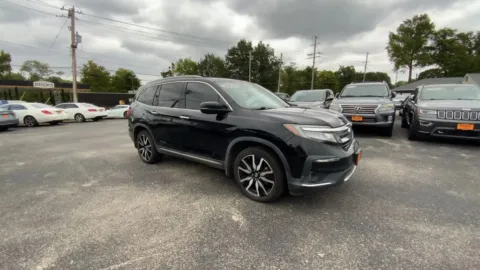 Photos of 2021 Honda Pilot Touring Sport Utility 4D for sale in Saint Charles, MO at Mathis Motors