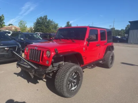 Red 2014 Jeep Wrangler Unlimited Sport for sale in Brighton, MI