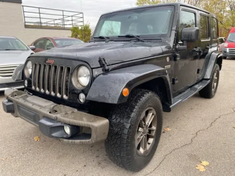 Black 2016 Jeep Wrangler Unlimited Sahara for sale in Wixom, MI