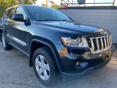 Black 2012 Jeep Grand Cherokee Laredo for sale in Wixom, MI