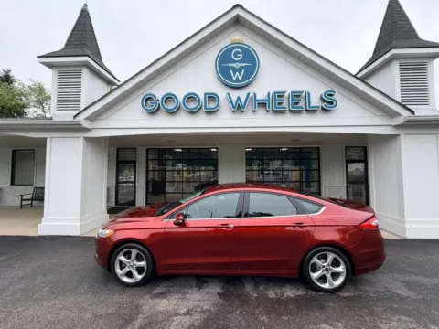 Orange 2014 Ford Fusion SE Sedan 4D for sale in Liverpool, OH