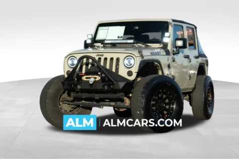 Beige 2017 Jeep Wrangler Unlimited Sport for sale in Athens, GA
