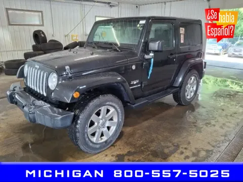 Black 2016 Jeep Wrangler Sahara for sale in Michigan Center, MI