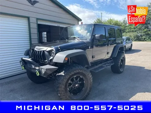 Black 2013 Jeep Wrangler Unlimited Sport for sale in Michigan Center, MI