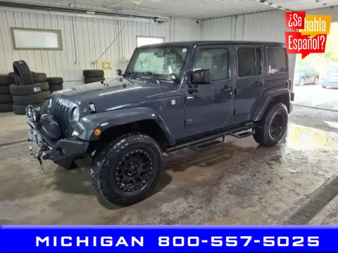 Gray 2016 Jeep Wrangler Unlimited Sport for sale in Michigan Center, MI