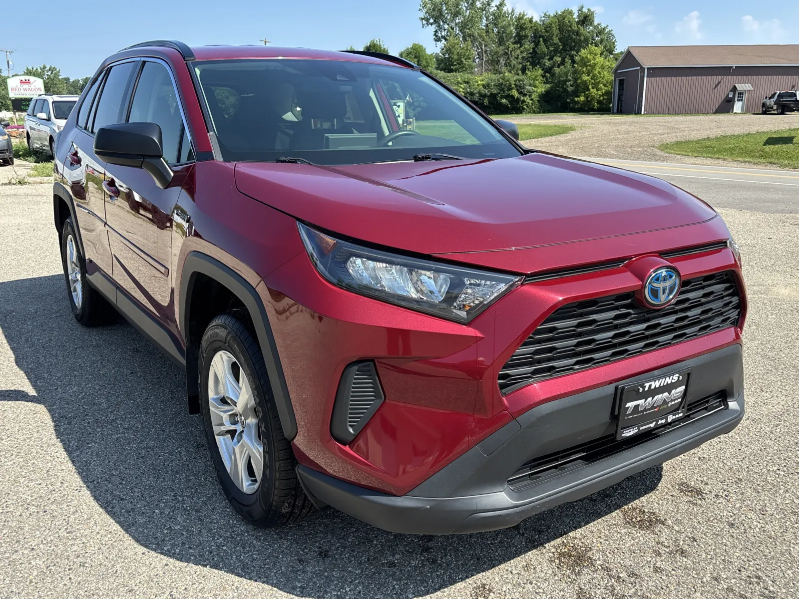 Red 2021 Toyota RAV4 Hybrid LE for sale in Wayland, MI