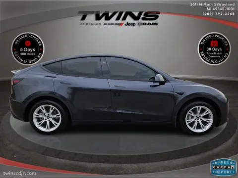 Photos of 2024 Tesla Model Y BASE for sale in Wayland, MI at Twins Chrysler Dodge Jeep Ram