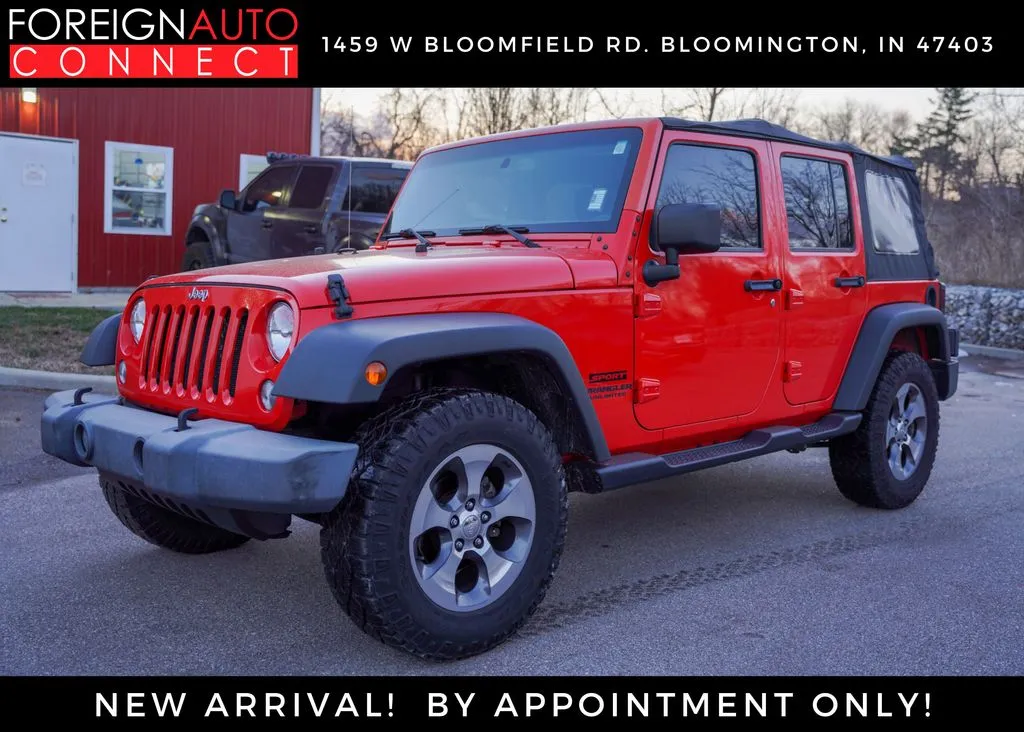Orange 2015 Jeep Wrangler Unlimited Sport for sale in Bloomington, IN