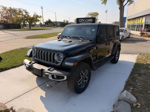 Black 2024 Jeep Wrangler 4-Door Sahara for sale in Troy, MI
