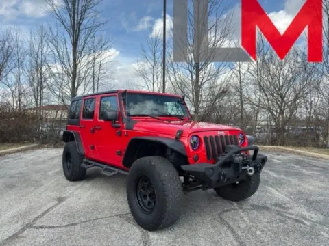 Red 2015 Jeep Wrangler Unlimited Sport for sale in Indianapolis, IN