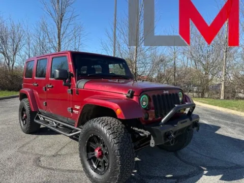 Red 2013 Jeep Wrangler Unlimited Sahara for sale in Indianapolis, IN