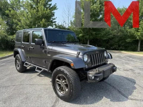Gray 2016 Jeep Wrangler Unlimited Sahara for sale in Indianapolis, IN