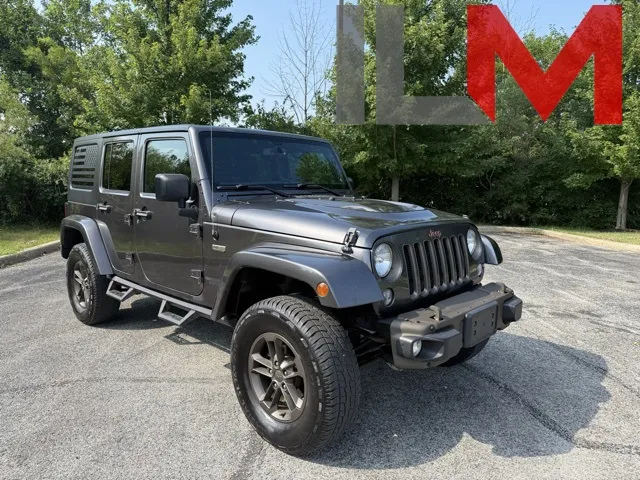 Gray 2016 Jeep Wrangler Unlimited Sahara for sale in Indianapolis, IN