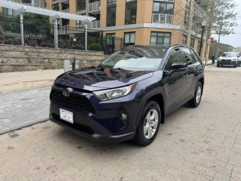 Blue 2021 TOYOTA RAV4 XLE for sale in Arlington, VA