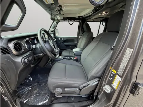 Photos of 2022 Jeep Wrangler Unlimited Willys Sport Utility 4D for sale in Jacksonville, FL at Merit Auto Group Atlantic