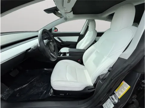 Photos of 2019 Tesla Model 3 Long Range Sedan 4D for sale in Jacksonville, FL at Merit Auto Group Atlantic