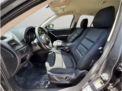 Photos of 2014 Mazda CX-5 Touring Sport Utility 4D for sale in Jacksonville, FL at Merit Auto Group Atlantic