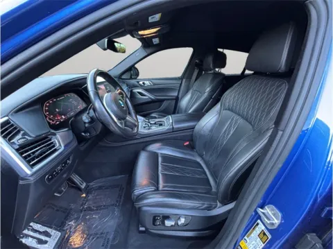 Photos of 2020 BMW X6 M50i Sport Utility 4D for sale in Jacksonville, FL at Merit Auto Group Atlantic