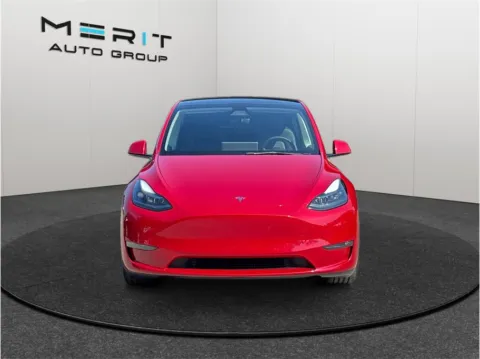 Photos of 2023 Tesla Model Y Performance Sport Utility 4D for sale in Jacksonville, FL at Merit Auto Group Atlantic