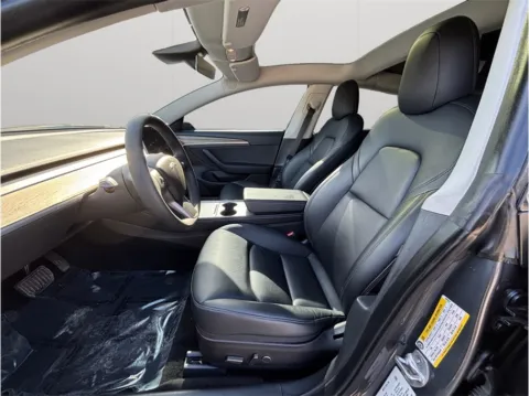 Photos of 2021 Tesla Model 3 Standard Range Plus Sedan 4D for sale in Jacksonville, FL at Merit Auto Group Atlantic