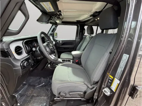 Photos of 2025 Jeep Wrangler 4 Door Sahara Sport Utility 4D for sale in Jacksonville, FL at Merit Auto Group Atlantic