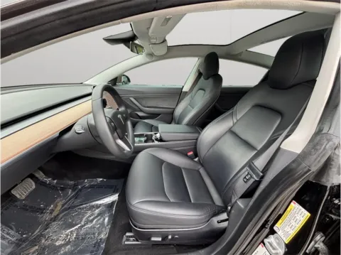 Photos of 2018 Tesla Model 3 Mid Range Sedan 4D for sale in Jacksonville, FL at Merit Auto Group Atlantic