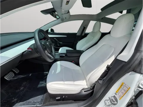 Photos of 2021 Tesla Model 3 Standard Range Plus Sedan 4D for sale in Jacksonville, FL at Merit Auto Group Atlantic