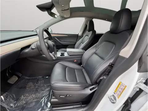 Photos of 2023 Tesla Model Y Long Range Sport Utility 4D for sale in Jacksonville, FL at Merit Auto Group Atlantic