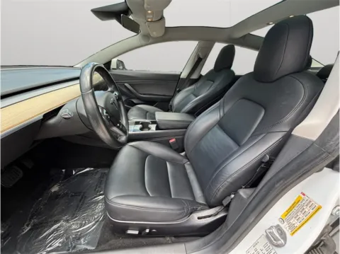 Photos of 2019 Tesla Model 3 Standard Range Plus Sedan 4D for sale in Jacksonville, FL at Merit Auto Group Atlantic