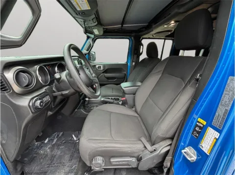 Photos of 2021 Jeep Wrangler Unlimited Willys Sport SUV 4D for sale in Jacksonville, FL at Merit Auto Group Atlantic