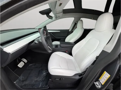 Photos of 2023 Tesla Model Y Performance Sport Utility 4D for sale in Jacksonville, FL at Merit Auto Group Atlantic