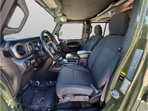 Photos of 2021 Jeep Wrangler Unlimited Willys Sport Utility 4D for sale in Jacksonville, FL at Merit Auto Group Atlantic