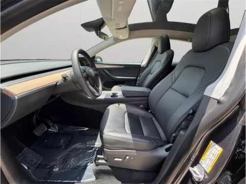 Photos of 2024 Tesla Model Y Standard Sport Utility 4D for sale in Jacksonville, FL at Merit Auto Group Atlantic