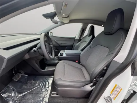 Photos of 2026 Tesla Model Y Standard Sport Utility 4D for sale in Jacksonville, FL at Merit Auto Group Atlantic