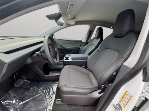 Photos of 2026 Tesla Model Y Standard Sport Utility 4D for sale in Jacksonville, FL at Merit Auto Group Atlantic