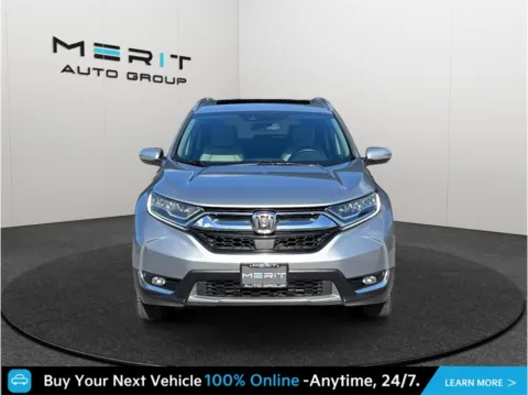 Photos of 2018 Honda CR-V Touring Sport Utility 4D for sale in Jacksonville, FL at Merit Auto Group Atlantic